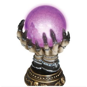 Spåkule i hender med lys - Lilla