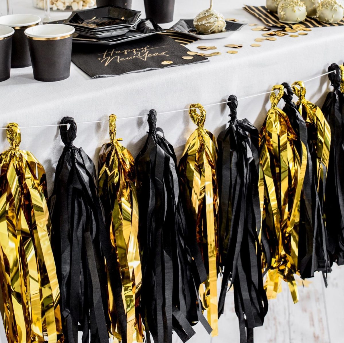 Girlander tassel - gull og svart